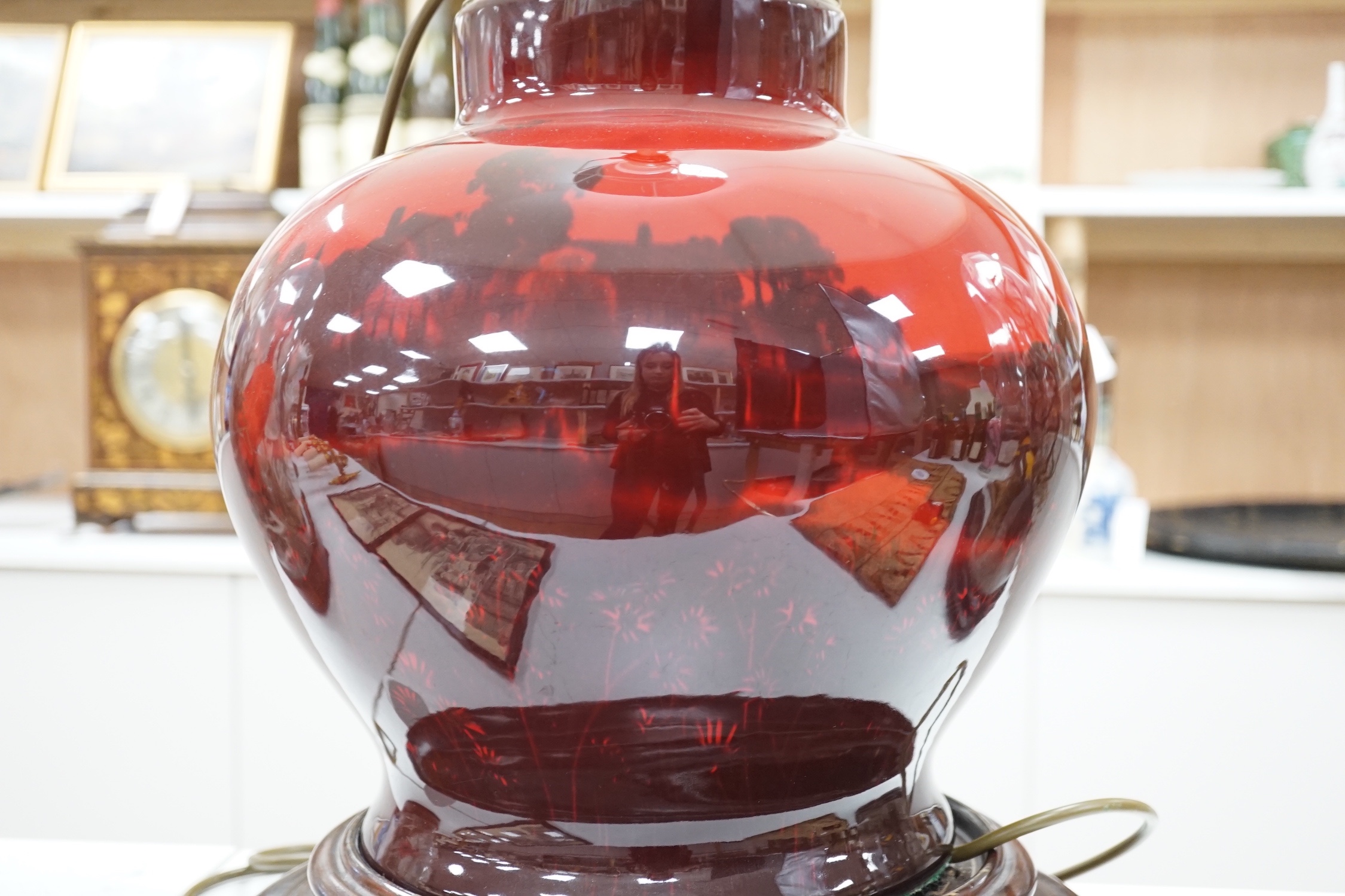 A large Royal Doulton flambe vase, approximately 30.5 cm high excluding all later fittings, mounted as a lamp with shade and associate wood stand.